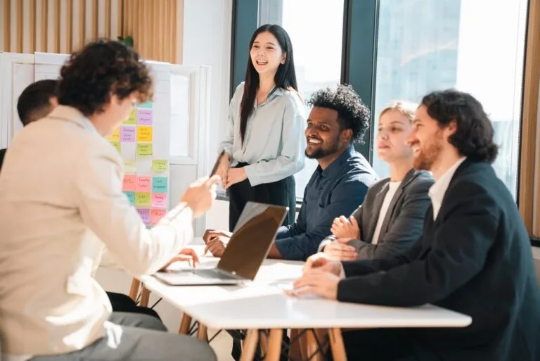 B2B business team discussing LinkedIn outreach strategy — Bee Connected Marketing